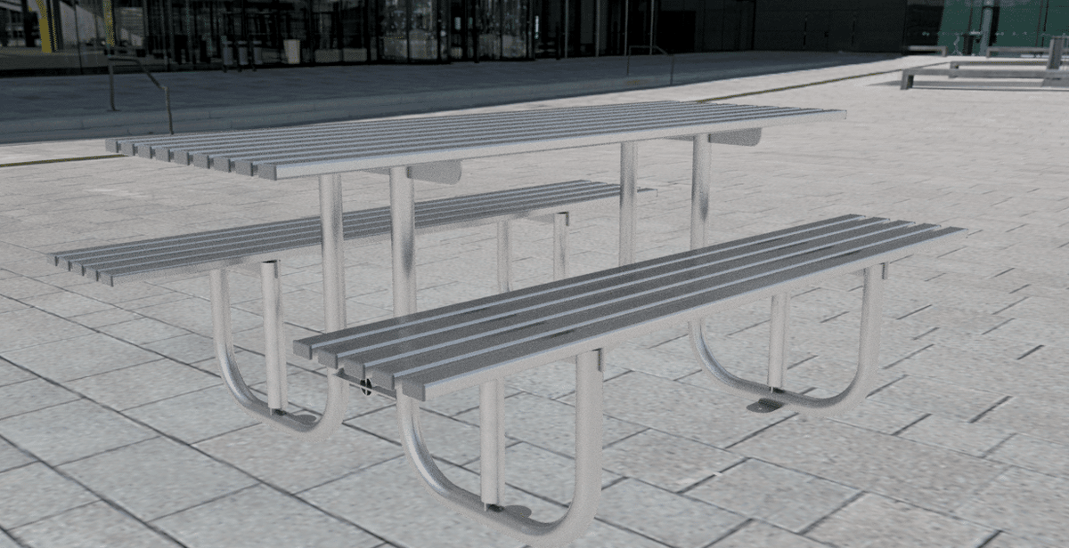 Galvanised steel picnic table bench installed on a paved public plaza