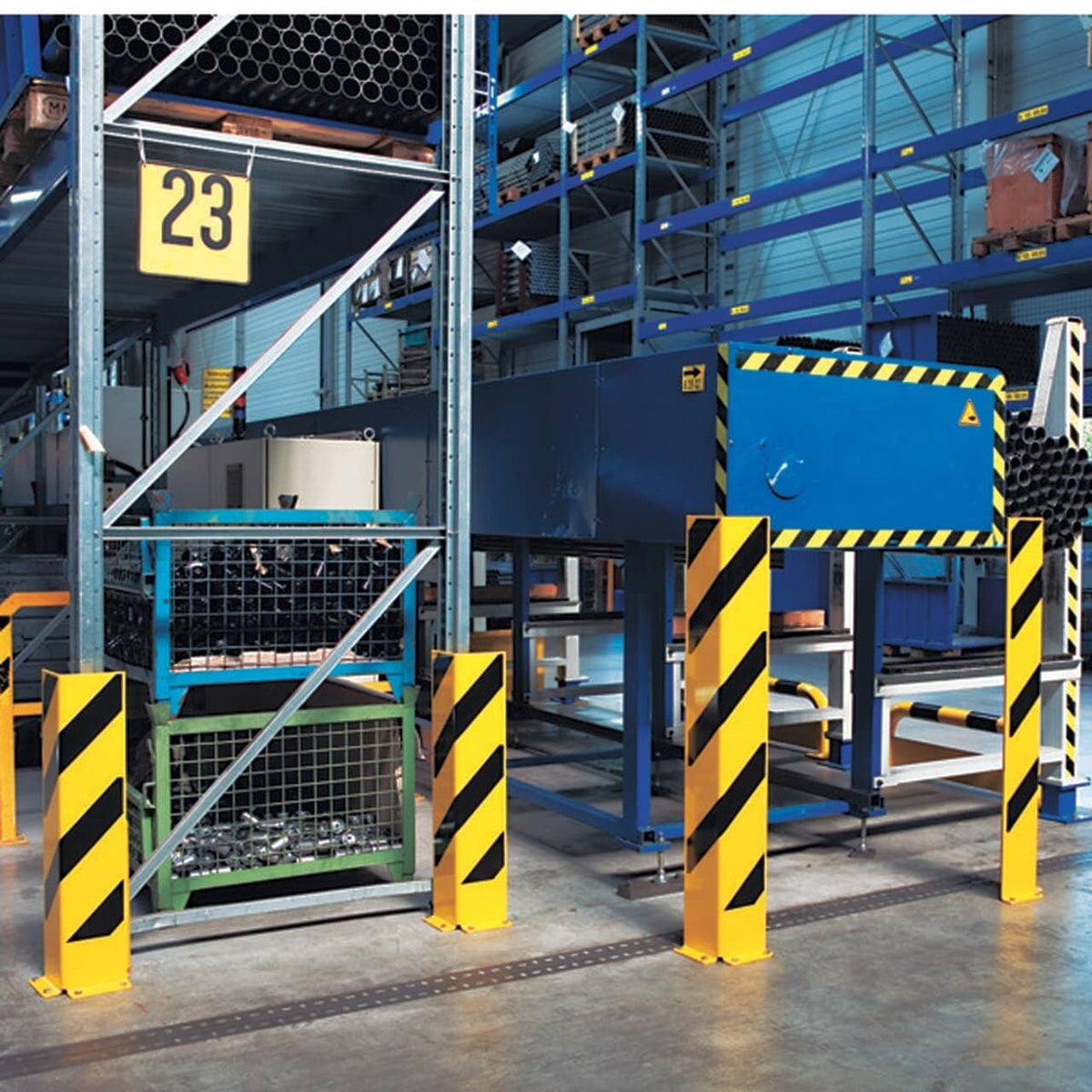Yellow and black steel pallet racking upright protectors fitted to racking in a working warehouse