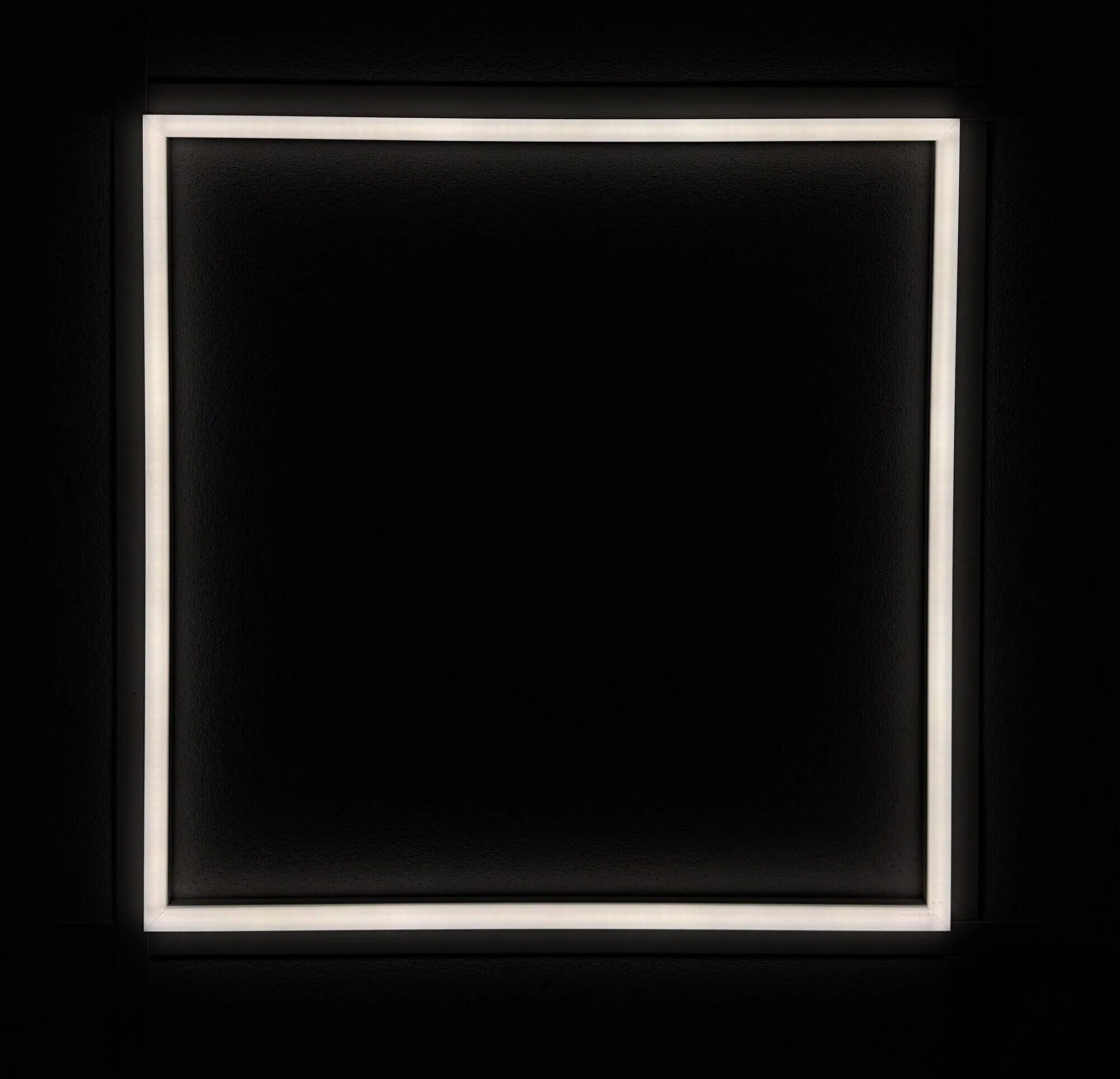 Square LED ceiling panel fitted in grid ceiling